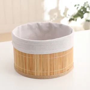 Detail shot of handmade bamboo woven storage basket with fabric liner for home organization.