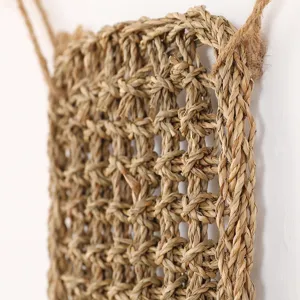 Detailed view of natural woven seagrass pet mat, handmade reptile grass pad texture and rope.
