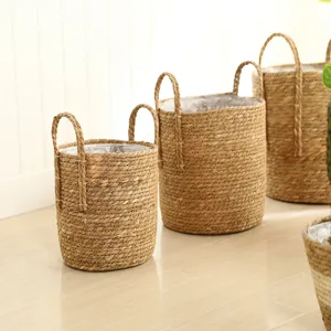 Nordic straw woven flower basket set with handles, natural plant fiber storage pot for indoor plants.
