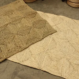 Detail view of natural corn husk braided mat, hand-woven floor rug for living room