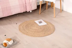 Natural corn husk woven round floor mat, handmade rustic home decor detail shot for cozy living.