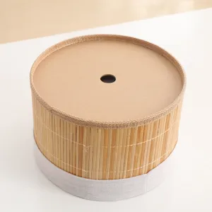 Handmade natural bamboo woven storage bucket detail, cylindrical design with lid and hole