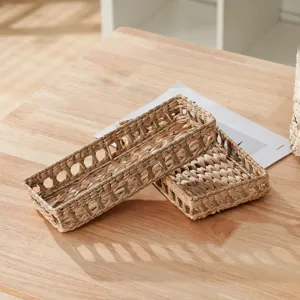 Woven storage basket detail shot, natural straw texture for desktop organization.