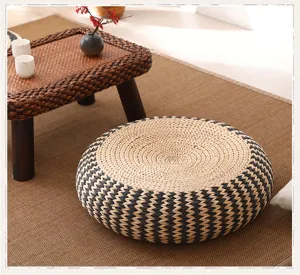 Detailed view of the woven tatami meditation cushion featuring durable natural straw texture.