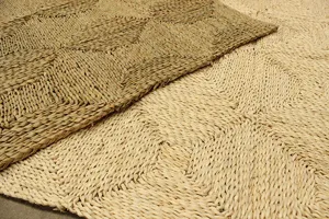 Natural woven corn leaf mat detail, showing textured chevron pattern for living room decor.