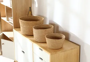 Handcrafted natural woven storage basket set of three, ideal for home organization and decor.