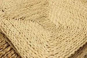 Natural corn leaf woven floor mat detail, eco-friendly straw cushion for living room decor.