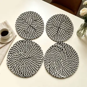 Set of 4 black and white round woven placemats, heat insulated table mat for kitchen decor.