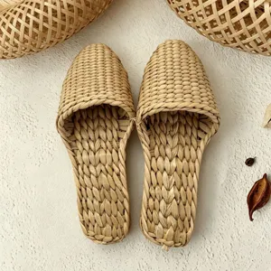 Woven rattan straw slippers for summer, breathable and comfortable indoor home wear.