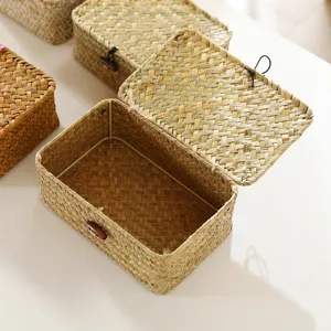 Detailed view of straw woven storage basket with lid, desktop organizer for home and gifts.