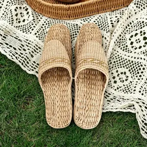 Close-up of natural hand-woven straw slippers showing fine texture and breathable comfort.