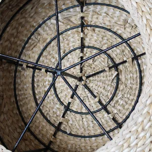 Straw woven floor pouf interior detail showing metal frame construction for home living room decor.