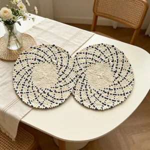 Detailed view of handmade woven placemats in blue and white, perfect dining table decor.