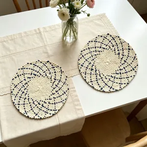 Round woven placemat detail view, natural fiber table mat for dining room, home kitchen decor.