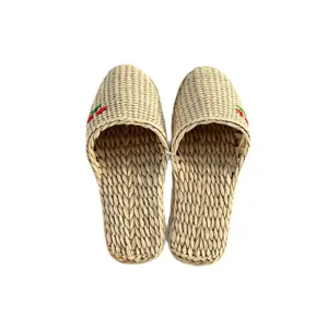 Handmade woven straw slippers for women and men, breathable closed toe indoor home shoes.