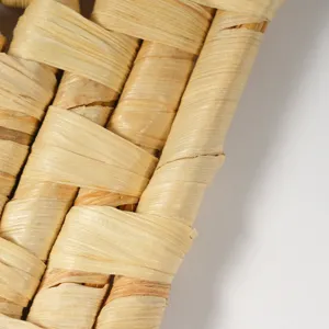 Natural woven straw heat insulation mat detail, eco-friendly kitchen coaster and tea pad.