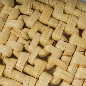 Close up texture detail of woven straw insulation mat, showing neat handcrafted surface.
