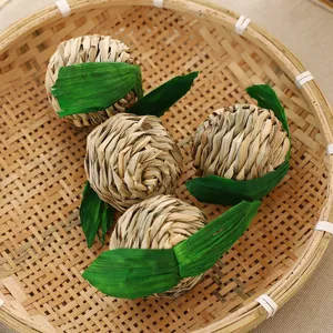 Natural woven grass pet chew ball apple shape toy for hamsters and rabbits, safe and fun.