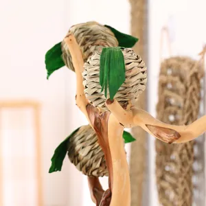Woven grass pet chew toy in apple shape, detailed close-up shot showing natural texture and branches.