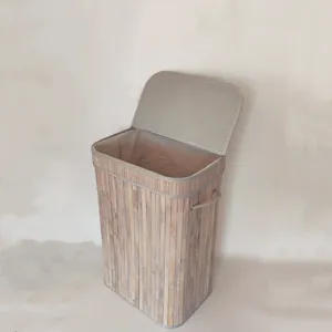 Detail view of the bamboo woven laundry hamper with lid and fabric interior lining storage.