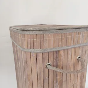 Bamboo woven storage basket detail showing the textured lid, sturdy fabric trim, and rope handle.