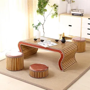 Traditional bamboo tatami tea table set with round stools for study, tea room and home decor.