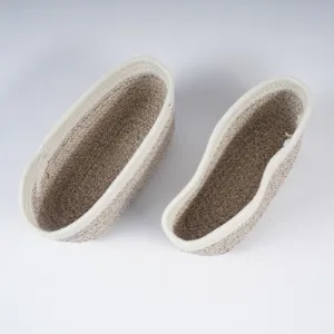 Detailed shot of woven cotton rope storage baskets, ideal for organizing home spaces neatly.