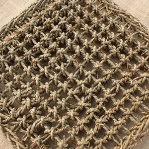 Natural straw woven pet mat detail shot, wear-resistant cat scratching pad texture view.