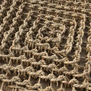 Natural straw woven pet mat close up texture detail for cat scratching pad and pet bed.
