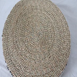 Handmade natural straw woven round tatami cushion detail view for home floor decor.