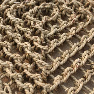 Close up view of natural woven straw pet mat texture, durable and breathable pet supply detail.