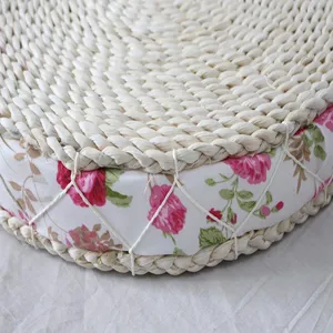 Handmade straw woven cushion detail, floral fabric edge, round tatami mat for bay window.