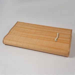 Detailed view showing the texture and rope handle of the bamboo woven storage box.