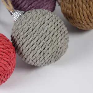 Colorful sisal rope Christmas ball ornament with silver cap and jute string for tree decor.