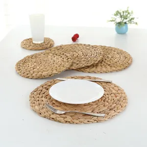Natural straw braided round placemats set, heat-resistant table mats for dining and kitchen use.