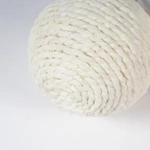 Close-up detail view of white woven paper rope hanging ball ornament for holiday decor.