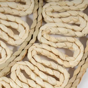 Close-up detail of handmade straw woven placemat, natural plant fiber texture design.