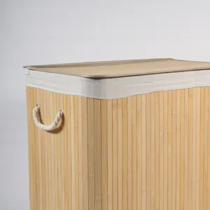 Close-up detail of the bamboo laundry hamper showing woven texture and sturdy rope handle.
