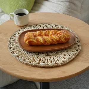 Handmade round straw placemat, natural woven corn husk table mat for dining room and kitchen decor.