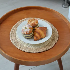 Handmade straw corn husk heat insulation mat, Japanese minimalist braided casserole mat detail.