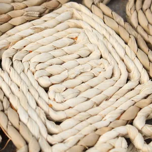Hand-woven natural straw grass floor mat, durable square braided texture rug detail view.