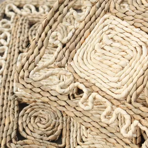 Handmade natural straw woven door mat close up texture detail for home bedroom floor decor