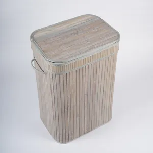 Panier à linge en bambou naturel avec couvercle et poignées, idéal pour chambre et salon.
