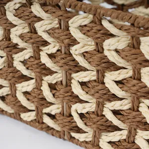 Handmade woven basket detail close up, brown and beige interlaced texture design.