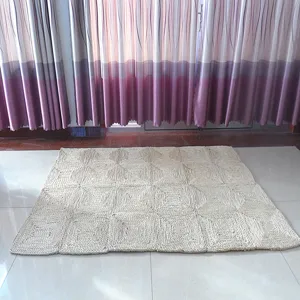 Handmade natural woven straw rug detail, tactile texture for living room decor and cozy floor mat.