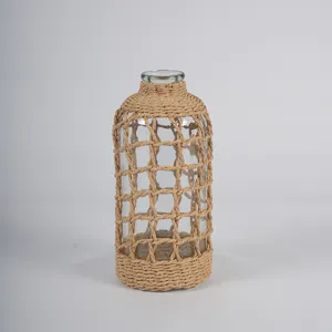 Housse de vase en verre transparent tressé en corde de papier pour belle décoration.