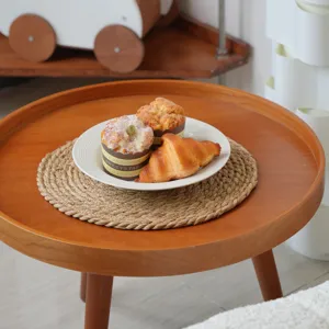 Hand-woven straw placemat scene detail, natural plant fiber heat insulation table pad.