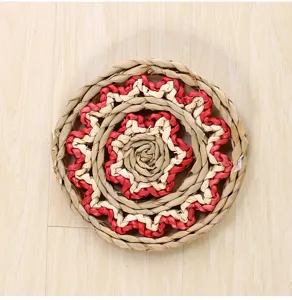 Woven straw wall hanging decor rustic floral round handicraft ornament for home interior styling.