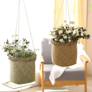 Handcrafted woven hanging flower basket for home decor, natural rattan plant holder for indoor.