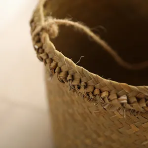 Handmade woven straw basket detail shot showing exquisite texture and natural material design.